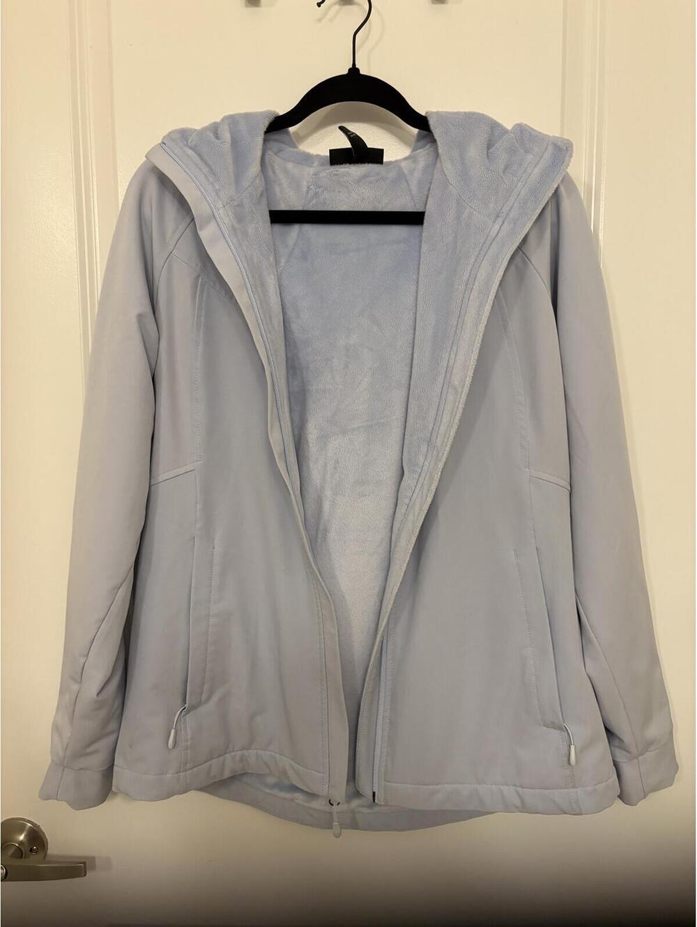 Light blue Kirkland Signature hooded jacket
